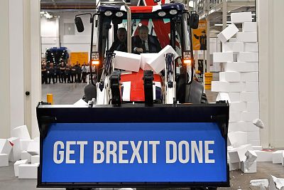 Johnson drives a backhoe with the words \'Get Brexit Done\' emblazoned on the bucket, at an event in Uttoxeter, Staffordshire, on Dec. 10.