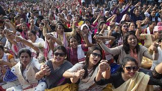 Image:Demonstrators hold hands and shout slogans during a protest on Thursd