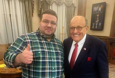 Ukrainian former diplomat Andriy Telizhenko and Rudolph Giuliani pose for a picture during a meeting in Kyiv on Dec. 5, 2019.