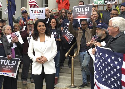 Tulsi Gabbard addresses a crowd outside the New Hampshire Statehouse in Concord on Nov. 5, 2019, after signing up to get on the Democratic ballot for the first-in-the-nation presidential primary.