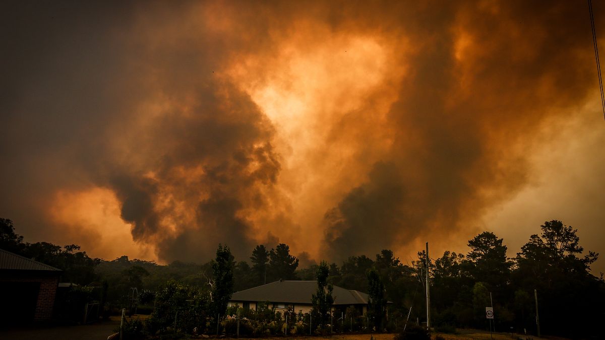 Image: Bushfires approach a home on the outskirts of the town of Bargo near