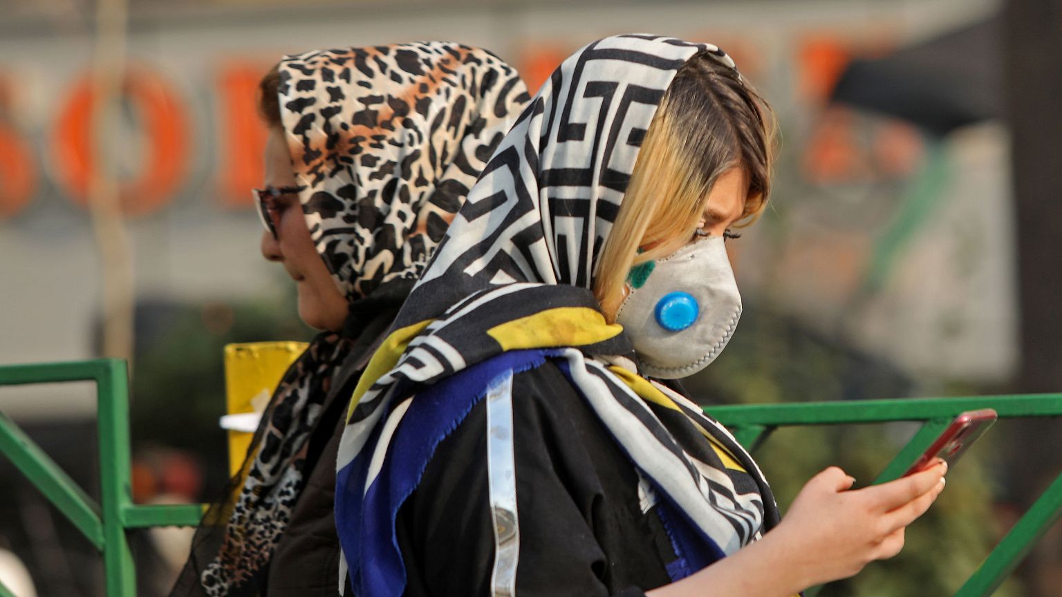 Image: An Iranian woman uses her cellphone on Dec. 23 in the capital Tehran