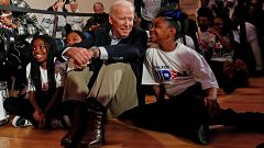 Former Vice President Joe Biden sits with kids from the Union Baptist Crusa