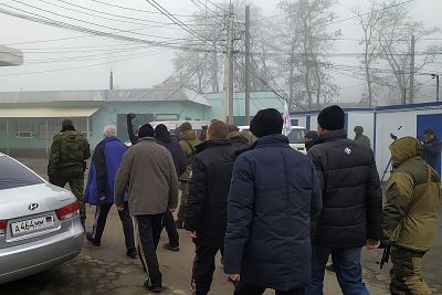 Ukrainian war prisoners escorted by Russia-backed separatist soldiers walk to be exchanged near the checkpoint Horlivka, eastern Ukraine, on Sunday.
