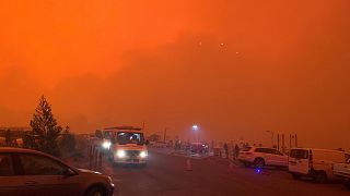 Image: The sky glows red as bushfires continue to rage in Mallacoota, Victo