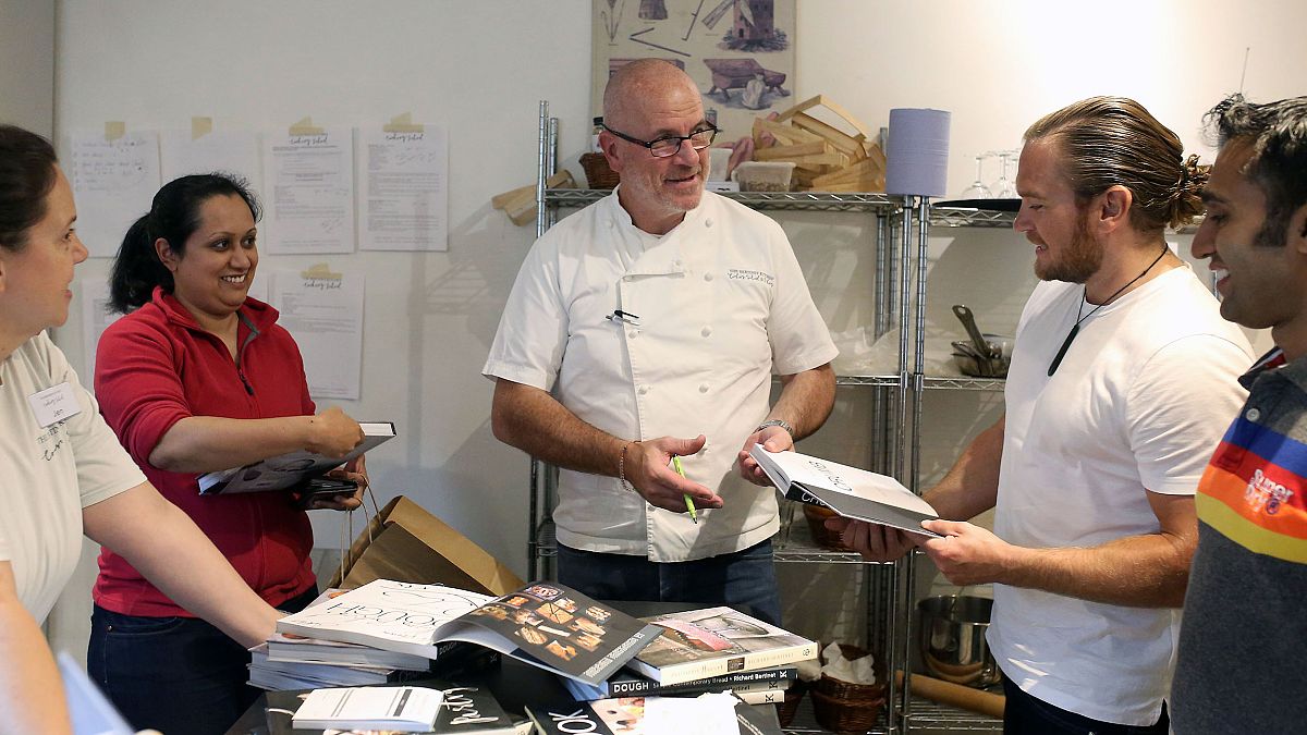 Image: French Chef Richard Bertinet signing copies of his cookery books for