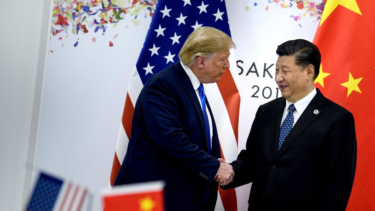 Image: President Donald Trump greets China's President Xi Jinping during th