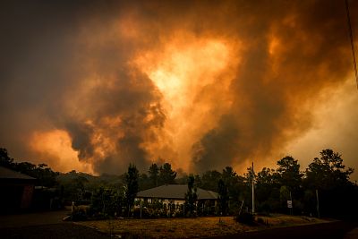 Fires approach a home in the outskirts of Bargo, near Sydney, on Dec. 21. 