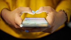 Woman Typing Phone Message On Social Network At Night