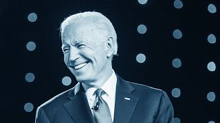 Joe Biden arrives on stage for the Democratic presidential candidate debate