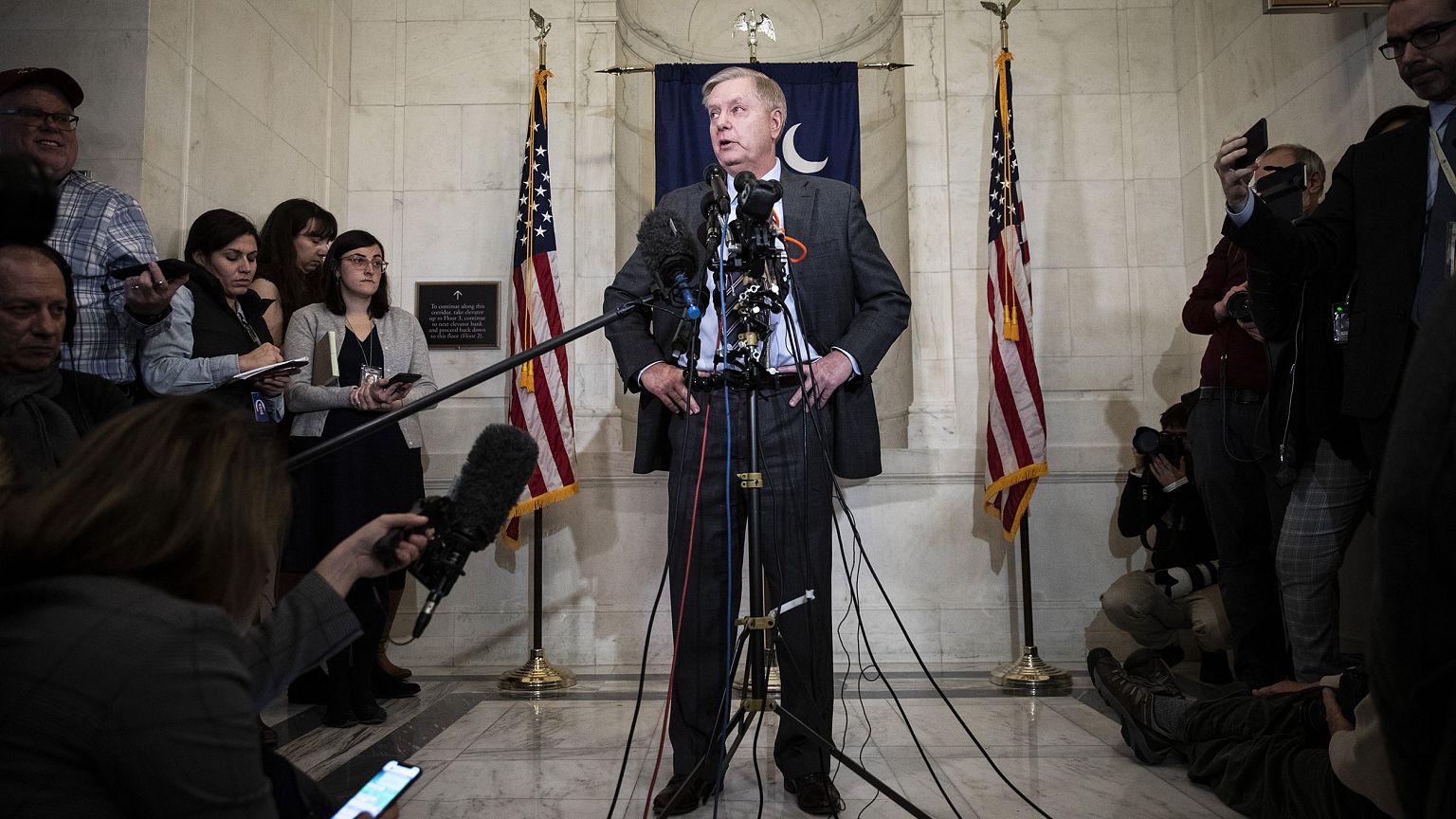 Image: Sen. Lindsey Graham, R-S.C., speaks to reporters outside his office 