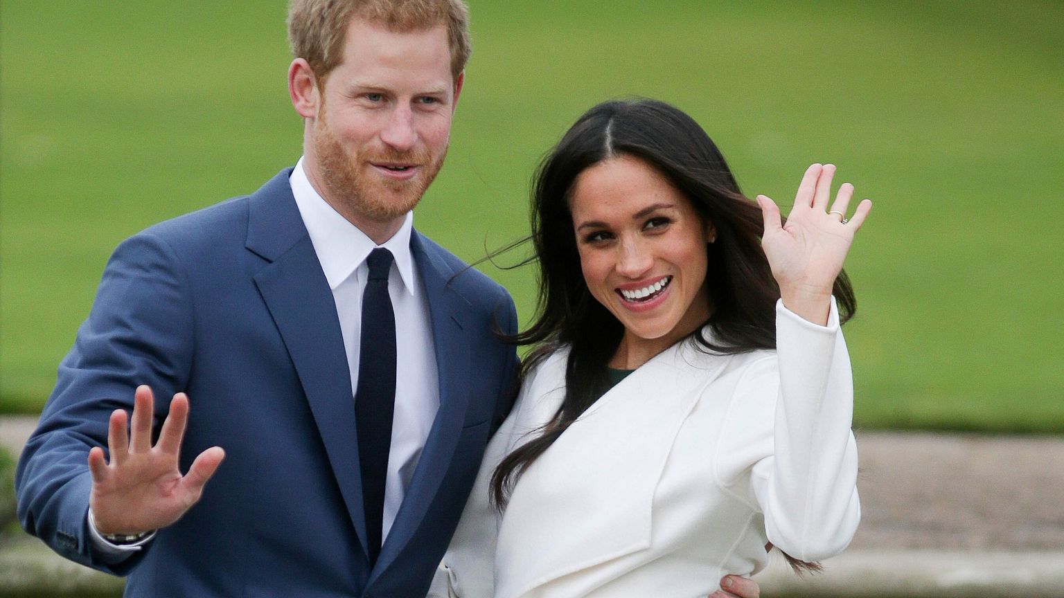 Image: Britain's Prince Harry and his fiancee Meghan Markle pose for a phot