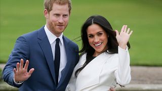 Image: Britain's Prince Harry and his fiancee Meghan Markle pose for a phot