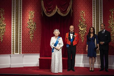 The empty space after the figures of Britain\'s Prince Harry and Meghan, Duchess of Sussex, were removed next to Queen Elizabeth II, Prince Philip and Prince William and Kate, Duchess of Cambridge, at Madame Tussauds in London on Jan. 9, 2020.