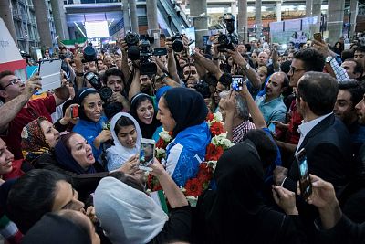 Kimia Alizadeh is greeted by Iranians upon her arrival at Imam Khomeini International Airport in Tehran after winning an Olympic bronze medal in August 2016.