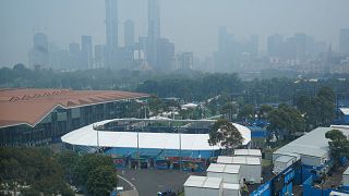 Image: The city skyline shrouded by smoke haze from bushfires during an Aus