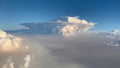 Image: Pyrocumulonimbus cloud formation is seen from a plane as bushfires c