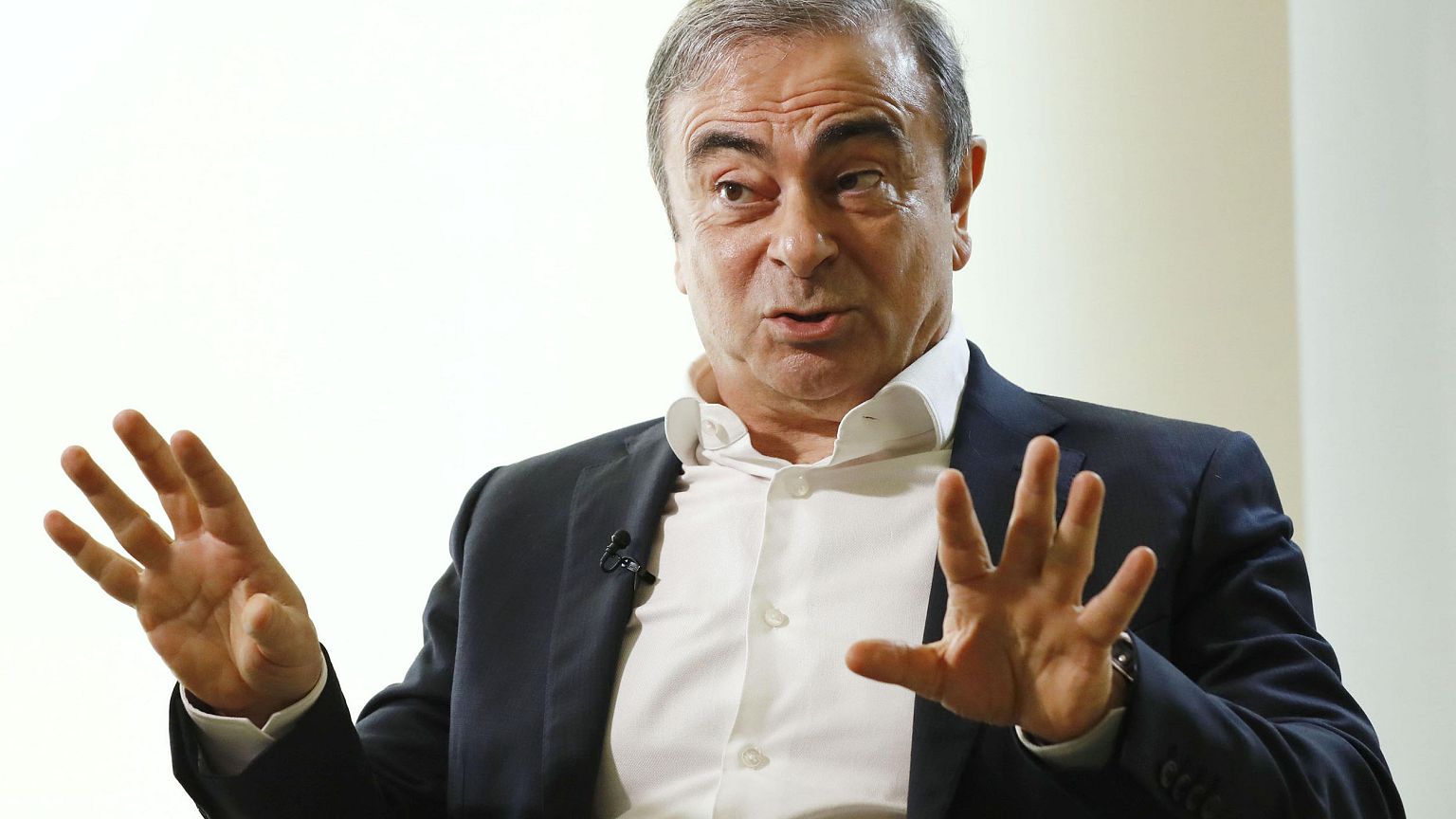 Image: Former Nissan Chairman Carlos Ghosn speaks to Japanese media during 