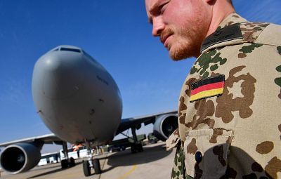 A German soldier stands next to a German air force Airbus A-310 aerial refueling tanker aircraft at the Al Azraq air base in Jordan.