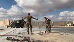 Image: U.S. soldiers clearing rubble at Ain al-Asad military airbase in the