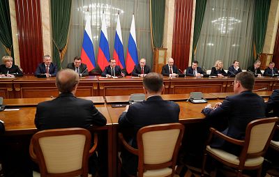 Putin, center, and Russian Prime Minister Dmitry Medvedev, center left, attend a cabinet meeting in Moscow on Wednesday.