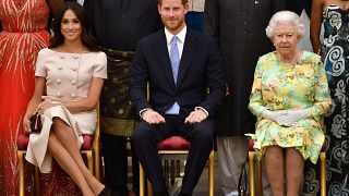 Image: FILE PHOTO: Britain's Queen Elizabeth, Prince Harry and Meghan, the