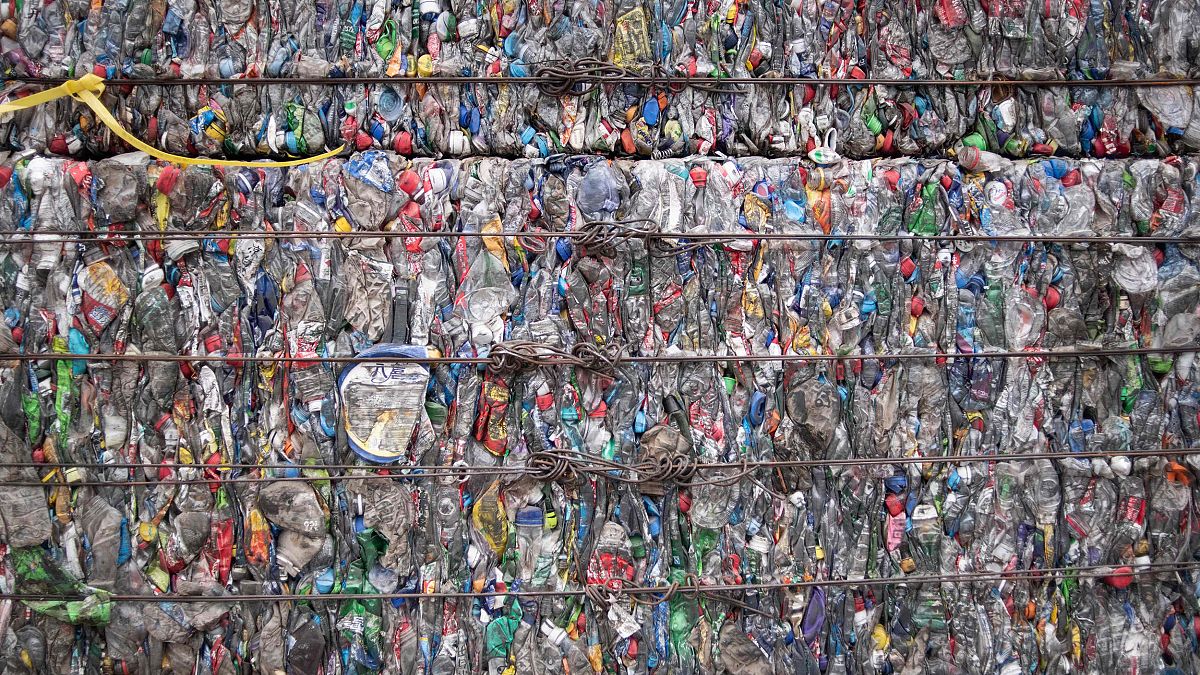 Image: A block of compressed plastic at a plastic waste center on the outsk