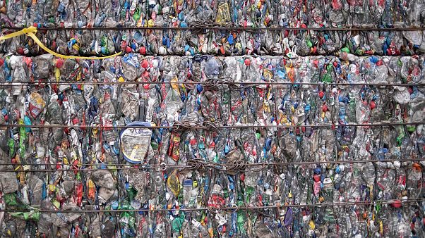 Image: A block of compressed plastic at a plastic waste center on the outsk Image: A block of compressed plastic at a plastic waste center on the outsk