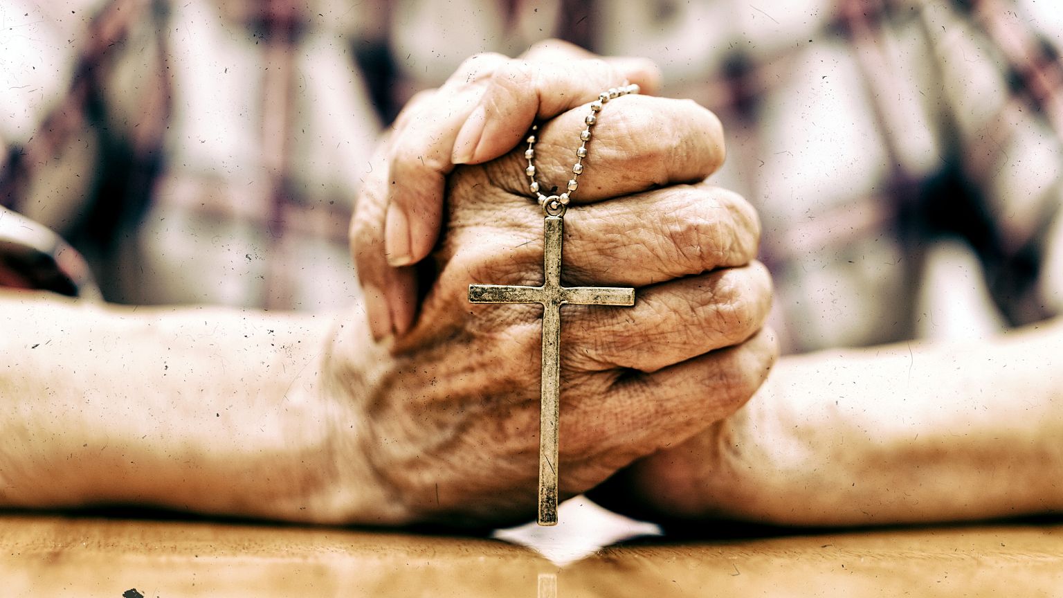 Image: Man holding cross