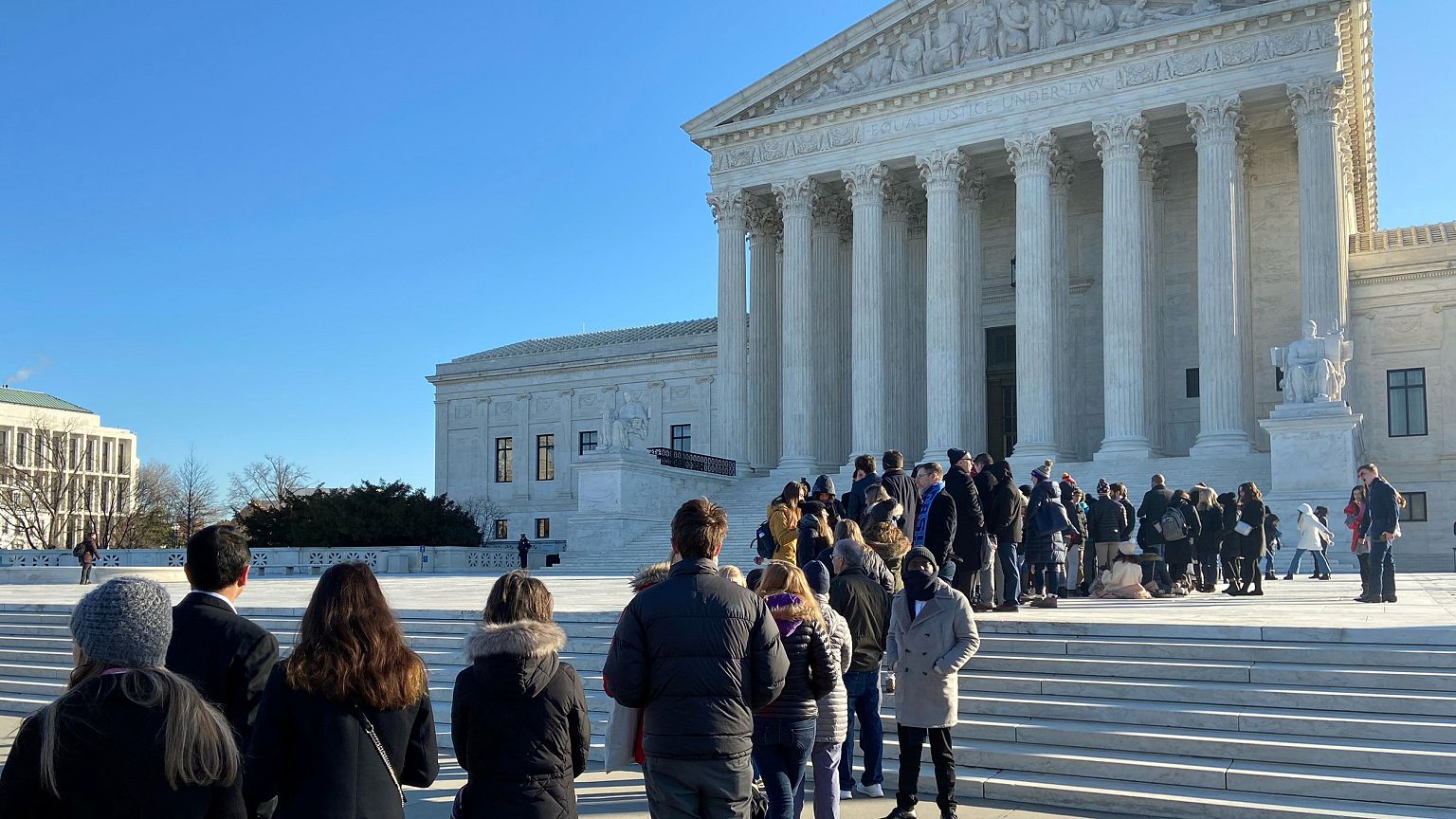 Image: People line up outside the Supreme Court ahead of oral arguments in 