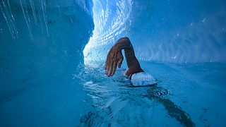 Lewis Pugh trains in a river under the Antarctic ice sheet, as he prepares 