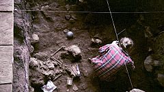 A researcher excavates the ancient bones at the Shum Laka rock shelter, whi