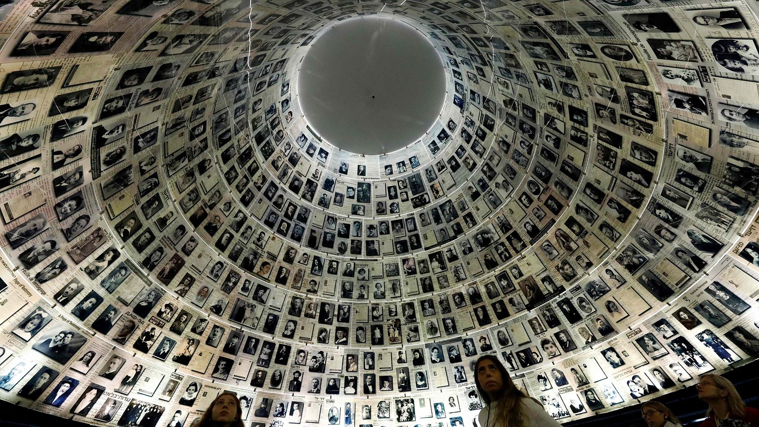 Image: Visitors look at the Hall of Names, a repository for the names of mi