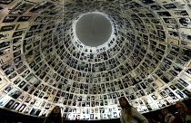 Image: Visitors look at the Hall of Names, a repository for the names of mi