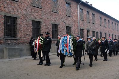 A delegation of survivors of the Auschwitz and their families arrive to lay wreaths at the camp\'s execution wall on Monday.
