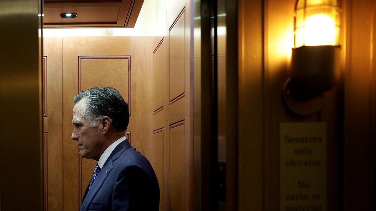 Image: Sen. Mitt Romney, R-Utah, leaves after a vote at the Capitol on Dec.