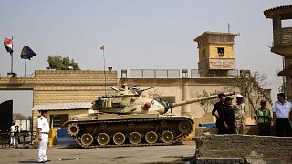 Egyptian security forces stand guard outside one of the entrances to the To