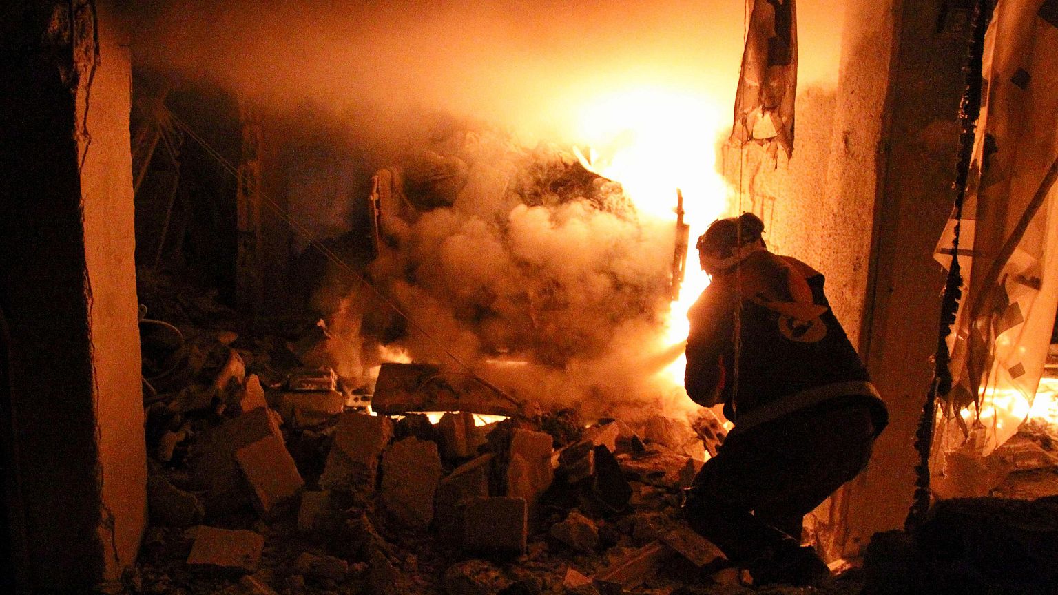 Image: A member of the Syrian Civil Defence, also known as the White Helmet