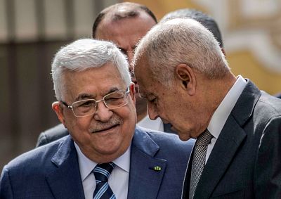 Palestinian president Mahmud Abbas speaks with Arab League Secretary-General Ahmed Aboul Gheit as they arrive to attend an Arab League emergency meeting in Cairo, Egypt on Saturday.