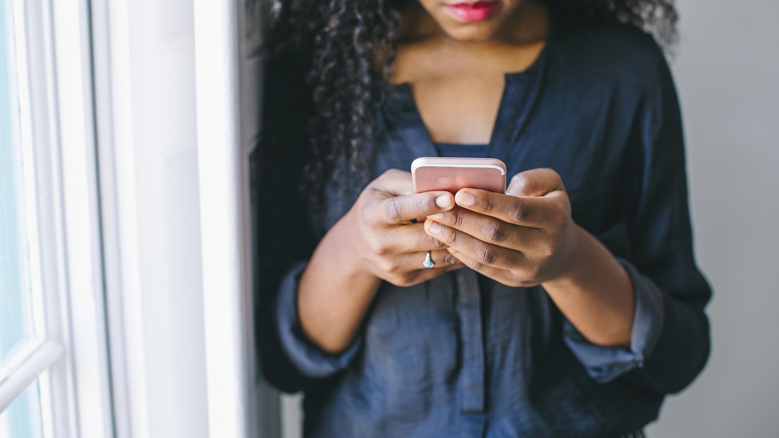Young woman using smart phone