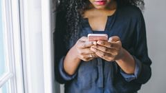 Young woman using smart phone
