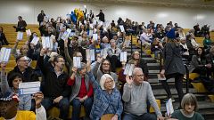 Image: Caucusgoers gather at the caucus site at Johnston Middle School in J