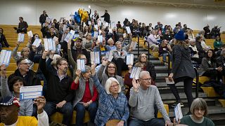 Image: Caucusgoers gather at the caucus site at Johnston Middle School in J