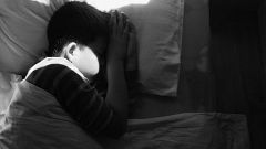 Image: boy asleep in bed