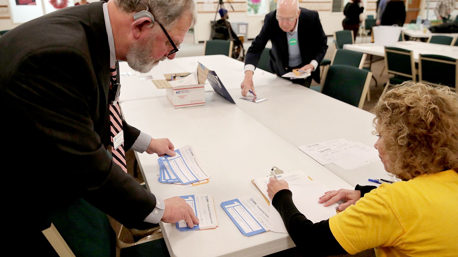 Image: Precinct workers tally Iowa Democratic Caucus votes by hand as caucu