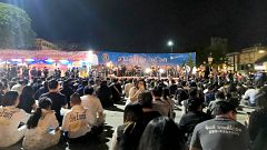 Image: Mourners attended a vigil for the victims of the shooting at the Tha