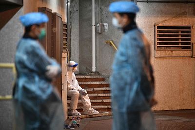 Medical personnel are posted at a residential estate in Hong Kong on Feb. 11.