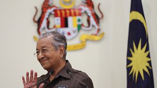 Image: Malaysian Prime Minister Mahathir Mohamad wave good bye to media aft