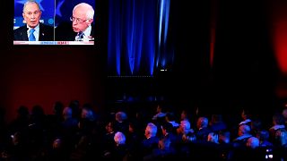 Image: The audience watches Mike Bloomberg and Sen. Bernie Sanders speak at
