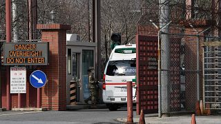 Image: An ambulance drives through the main gate of US Army Camp Carroll in